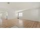 Bright, open living room features wood floors and a stylish chandelier at 4061 Flowering Peach Ln, St Cloud, FL 34772