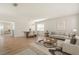 Bright living and dining areas offer open-concept living and a modern chandelier at 4061 Flowering Peach Ln, St Cloud, FL 34772