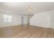 Bright and airy living room with tile flooring and a view of the staircase at 4061 Flowering Peach Ln, St Cloud, FL 34772