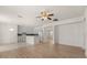 Open concept living area with a ceiling fan and a view of the kitchen at 4061 Flowering Peach Ln, St Cloud, FL 34772