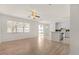 Open living area with a ceiling fan and a view of the backyard and the kitchen at 4061 Flowering Peach Ln, St Cloud, FL 34772