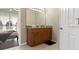 Bright bathroom with wood vanity with a sink and a view of the bedroom at 407 Reserve Dr, Davenport, FL 33896