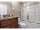 Bathroom featuring a vanity with sink, granite counters and a tub-shower combo at 407 Reserve Dr, Davenport, FL 33896