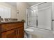 Well-maintained bathroom featuring a shower, toilet, and vanity, offering a functional and clean space at 407 Reserve Dr, Davenport, FL 33896