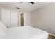 Bright bedroom featuring a closet and white bedding, perfect for a cozy and inviting atmosphere at 407 Reserve Dr, Davenport, FL 33896