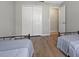 Spacious bedroom featuring two beds, gray linens, and a view of the closet at 407 Reserve Dr, Davenport, FL 33896