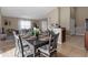 Cozy dining area featuring a dark wood table with seating for four and views to the living area at 407 Reserve Dr, Davenport, FL 33896