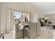 Cozy dining area featuring comfortable seating and a view of the outdoor pool area at 407 Reserve Dr, Davenport, FL 33896