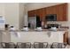 Contemporary kitchen offering granite countertops, breakfast bar and stainless steel appliances at 407 Reserve Dr, Davenport, FL 33896