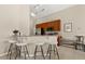 Stylish kitchen with modern appliances, a breakfast bar, and sleek countertops perfect for entertaining at 407 Reserve Dr, Davenport, FL 33896