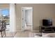 Living area with access to the patio and an open view to the dining area at 407 Reserve Dr, Davenport, FL 33896