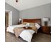 Serene main bedroom with a comfortable king-size bed and soft, neutral decor at 407 Reserve Dr, Davenport, FL 33896