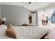 Inviting main bedroom with large bed and access to a private backyard patio at 407 Reserve Dr, Davenport, FL 33896