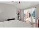 Spacious main bedroom with natural light, wood-look floors, and sliding glass doors at 407 Reserve Dr, Davenport, FL 33896