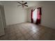Bedroom with tile flooring and a ceiling fan at 4179 Spitfire Ave, Kissimmee, FL 34741