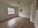 Bedroom with tile flooring, a window, and closet space at 4179 Spitfire Ave, Kissimmee, FL 34741