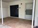 Covered patio area with tile flooring and a sliding glass door at 4179 Spitfire Ave, Kissimmee, FL 34741