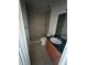 Bathroom featuring a tiled walk-in shower, vanity with sink, and a toilet at 445 Fountainhead Cir # 264, Kissimmee, FL 34741