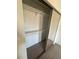 Bedroom closet with mirrored doors, shelving and storage, and carpeted floors at 445 Fountainhead Cir # 264, Kissimmee, FL 34741