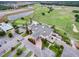 Aerial view of a golf course, clubhouse, and lakes in a beautiful residential community at 478 Chelsea Ave, Davenport, FL 33837