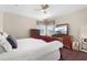 Cozy bedroom with dark wood floors, light walls, and two windows at 478 Chelsea Ave, Davenport, FL 33837