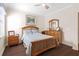 Comfortable bedroom with hardwood floors, and warm light at 478 Chelsea Ave, Davenport, FL 33837
