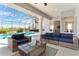 Comfortable covered patio with stylish seating, providing a serene outdoor living space overlooking the pool at 478 Chelsea Ave, Davenport, FL 33837