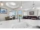 View from kitchen island to living room, pool, and lanai at 478 Chelsea Ave, Davenport, FL 33837