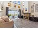 Spacious living room with soaring ceilings, a fireplace, and sliding glass doors to the pool area at 478 Chelsea Ave, Davenport, FL 33837