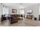 Spacious living room featuring natural light, hardwood floors, neutral wall paint, and comfortable seating at 478 Chelsea Ave, Davenport, FL 33837