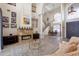 Bright living room with a fireplace, chandelier, high ceilings, and an open floor plan to the dining area at 478 Chelsea Ave, Davenport, FL 33837