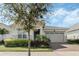 Lovely single-Gathering home with beautiful landscaping and a two-car garage, complete with a paver driveway at 5151 Twin Lakes Blvd, St Cloud, FL 34772