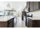 Well-equipped kitchen featuring stainless steel appliances, granite countertops, and ample cabinet space at 5151 Twin Lakes Blvd, St Cloud, FL 34772