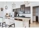 Stylish kitchen featuring granite countertops, stainless steel appliances, and a center island with seating at 5151 Twin Lakes Blvd, St Cloud, FL 34772