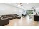 Bright open-concept living room featuring a dining area, comfortable seating, and access to an enclosed patio at 5151 Twin Lakes Blvd, St Cloud, FL 34772