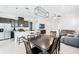 Open-concept living area featuring a modern kitchen, dining table, and comfortable seating area at 5151 Twin Lakes Blvd, St Cloud, FL 34772