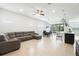 Spacious living room boasts tile floors, modern furniture, and an open-concept layout with a dining area at 5151 Twin Lakes Blvd, St Cloud, FL 34772