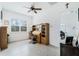Bright office space with a ceiling fan, large window, and built-in shelving at 5151 Twin Lakes Blvd, St Cloud, FL 34772