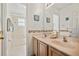 Bright bathroom with double sinks and a mosaic backsplash, with the toilet and shower through the doorway at 5516 Willow Bend Trl, Kissimmee, FL 34758