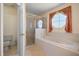 Well-maintained bathroom with a tub shower combination and a separate toilet room at 5516 Willow Bend Trl, Kissimmee, FL 34758