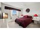 Bedroom with a large window, complemented by unique decor elements and stylish furnishings at 5516 Willow Bend Trl, Kissimmee, FL 34758