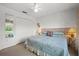 Serene bedroom featuring a spacious closet and a large window with a view of the lake at 5516 Willow Bend Trl, Kissimmee, FL 34758