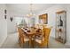 Formal dining room with a chandelier, large window, and seating for eight, perfect for entertaining at 5516 Willow Bend Trl, Kissimmee, FL 34758