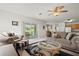 Bright, open living space with comfortable seating, sliding glass doors, and access to outdoor views at 5516 Willow Bend Trl, Kissimmee, FL 34758