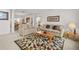 Bright living room with comfortable seating, area rug, and dining area in background at 5516 Willow Bend Trl, Kissimmee, FL 34758