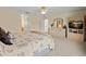 Bright main bedroom boasting neutral tones, a ceiling fan, and an entertainment center at 5516 Willow Bend Trl, Kissimmee, FL 34758