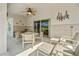 Covered patio with a dining table, chairs, and a ceiling fan at 5516 Willow Bend Trl, Kissimmee, FL 34758