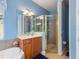 Charming bathroom with a glass enclosed shower, stylish vanity, and tiled walls, offering a luxurious feel at 722 Portofino Dr, Kissimmee, FL 34759