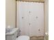 Cozy bathroom featuring a shower with a decorative palm tree shower curtain at 722 Portofino Dr, Kissimmee, FL 34759