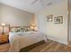 Neutral bedroom showcasing wood-look floors, and traditional decor at 722 Portofino Dr, Kissimmee, FL 34759